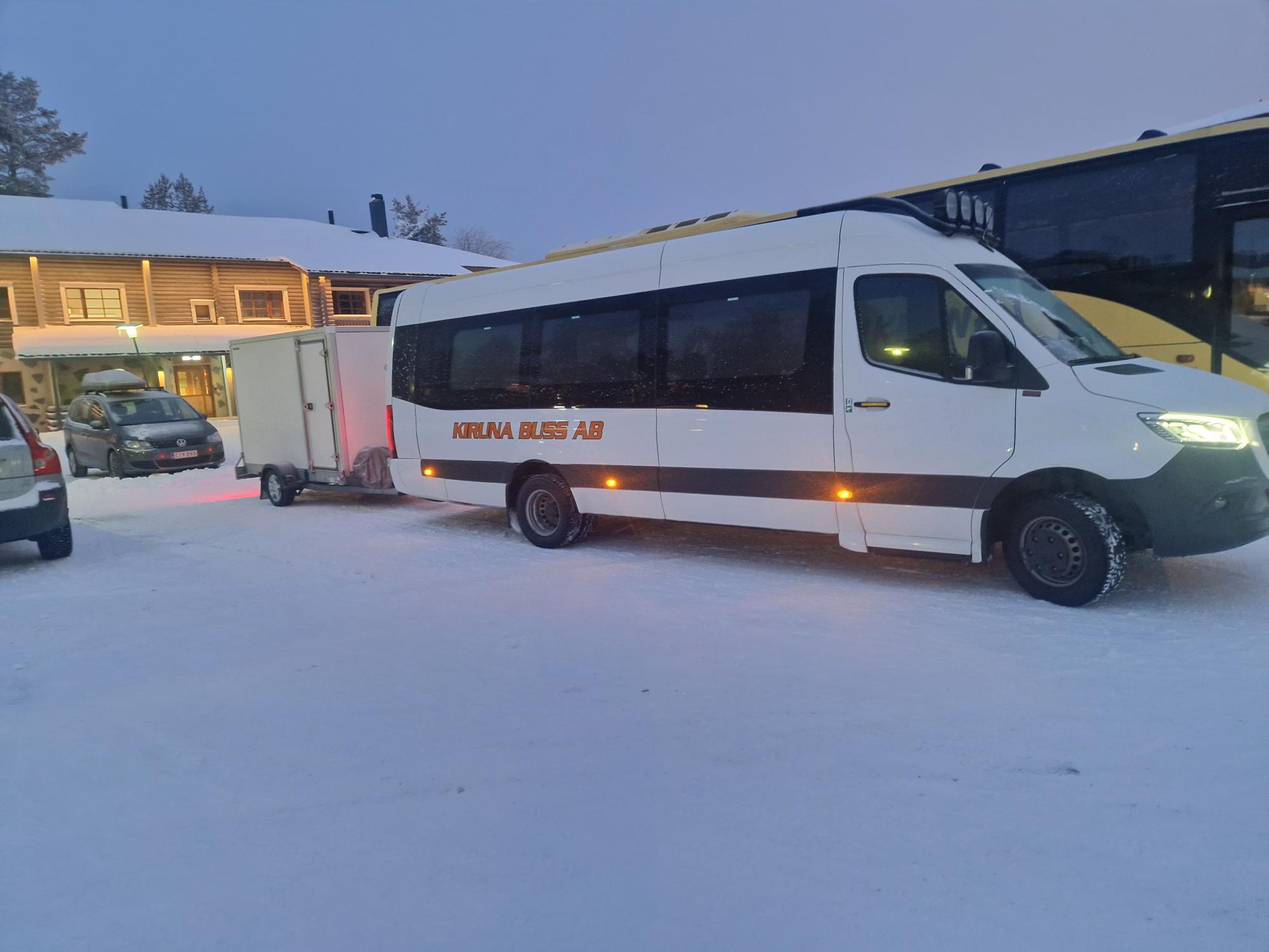 Kiruna Buss airport transfer vehicle in a winter landscape